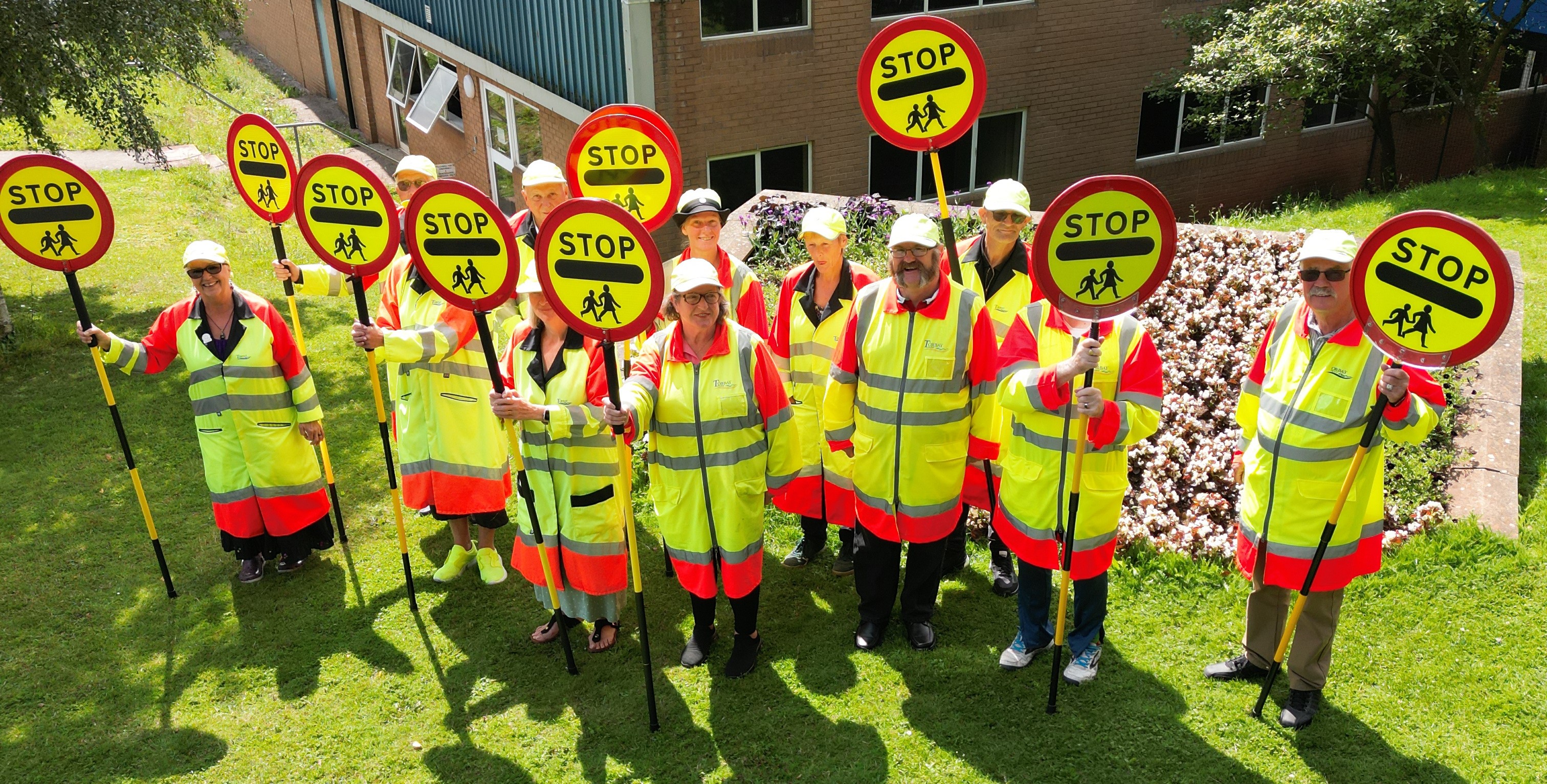 Our School Crossing patrol officers posing in their uniform